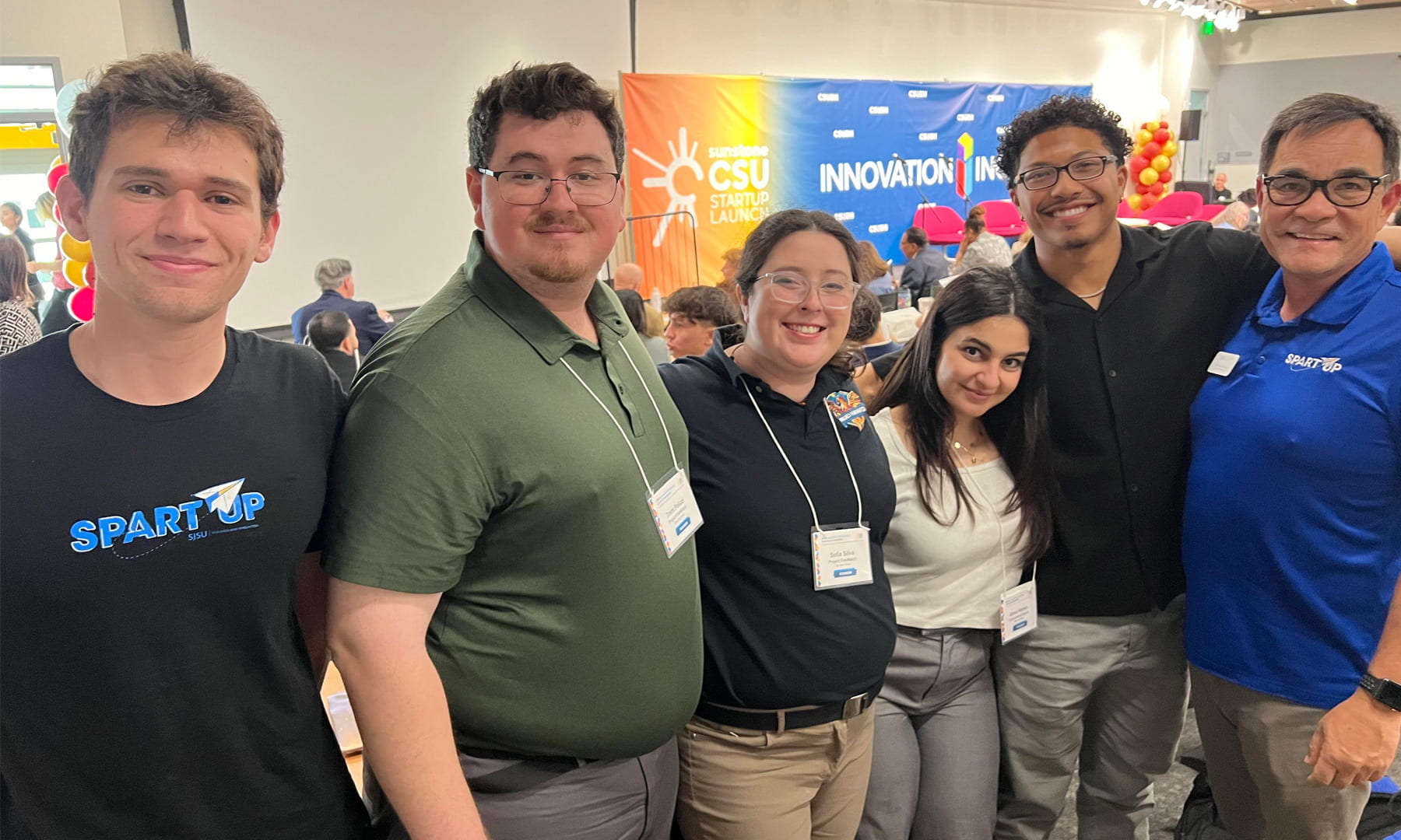 ConcussionCoach and Firewatch student groups pose with SpartUp staff