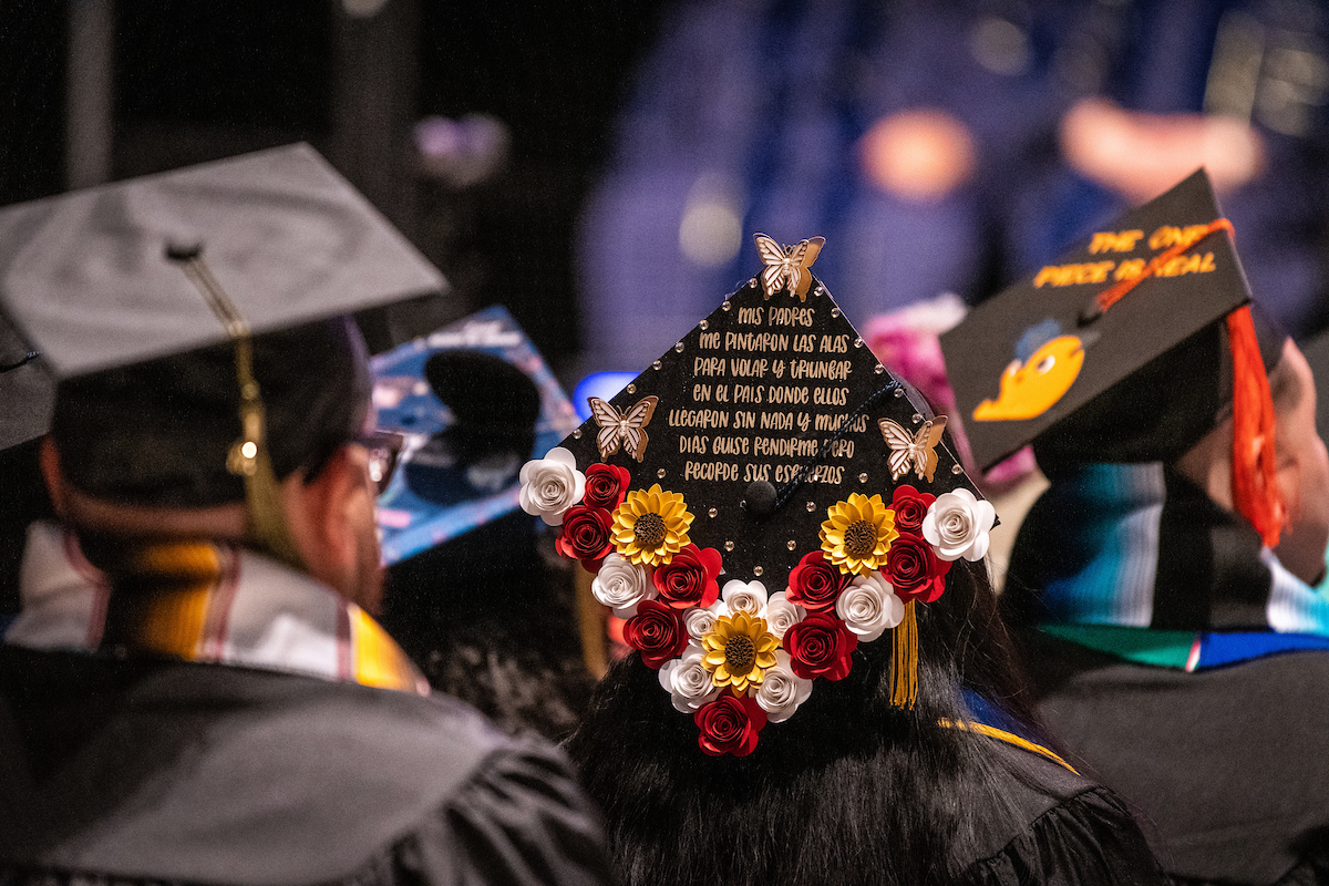 Graduate with a decerated mortarboard