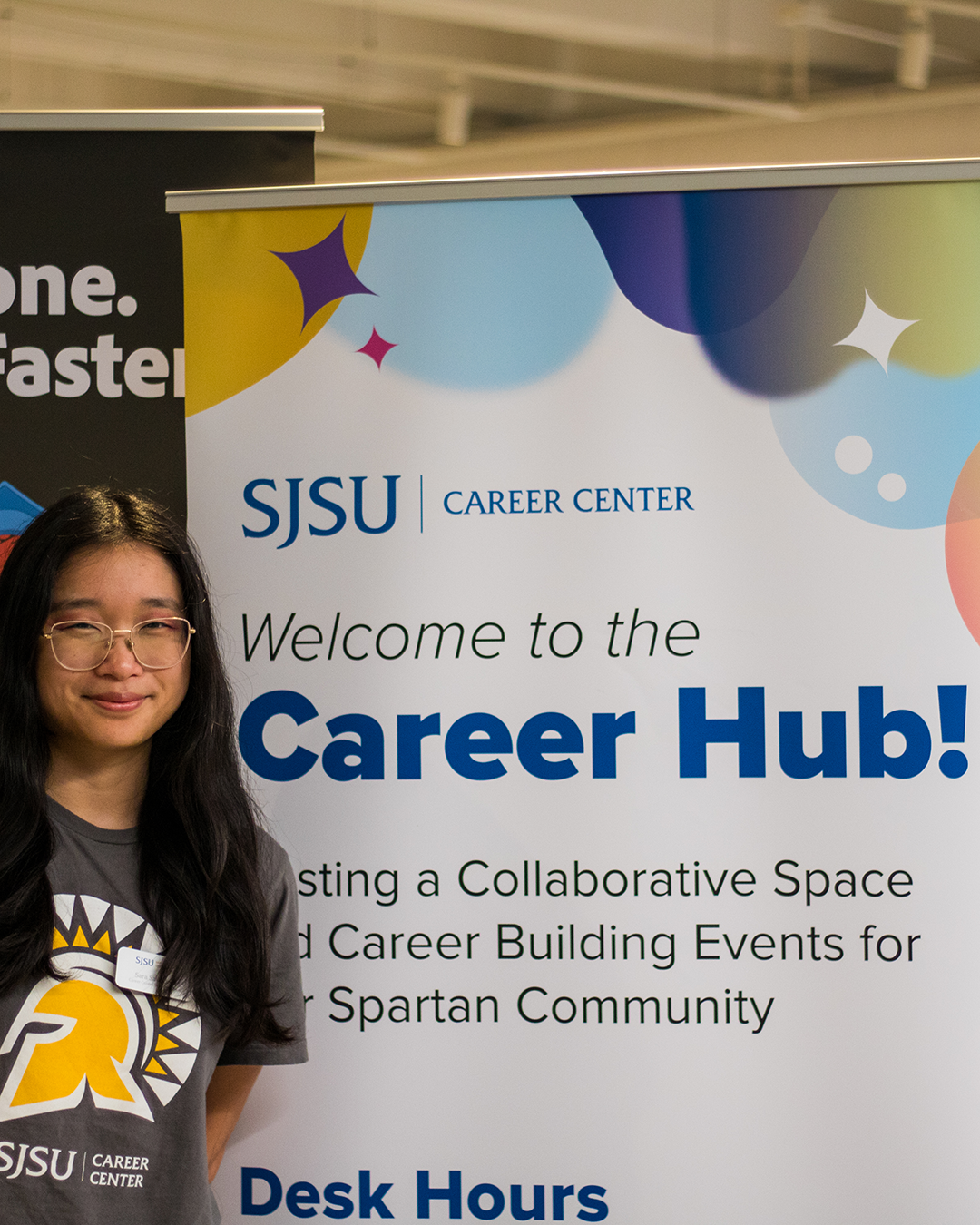 Sara Saunders standing in front of the Career Hub banner
